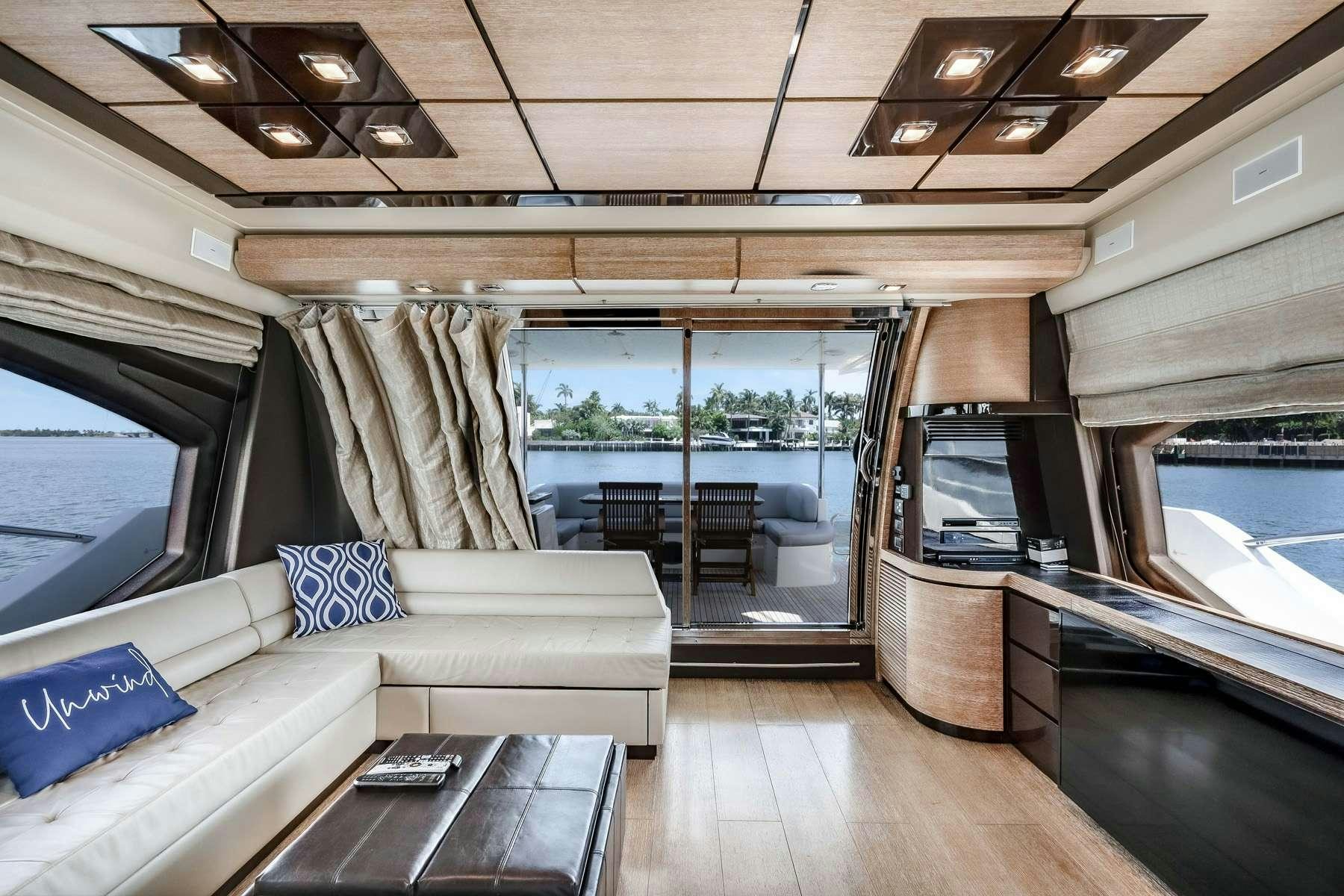 a living room with a couch and a table aboard DAYS LIKE THIS Yacht for Charter