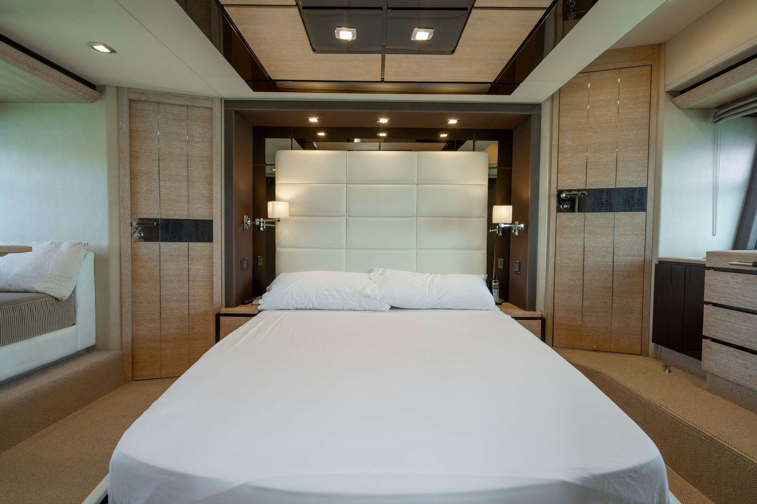 a large bed in a room aboard DAYS LIKE THIS Yacht for Charter