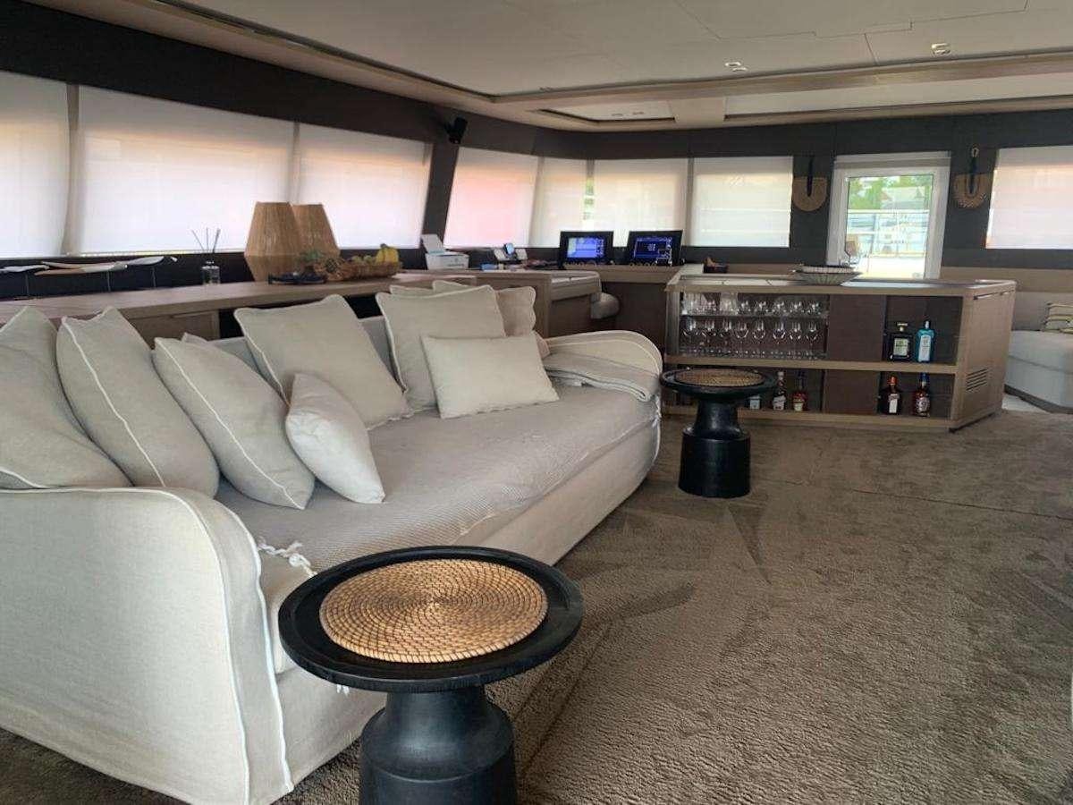 a room with a couch and a television aboard JUST MARIE 2 Yacht for Charter