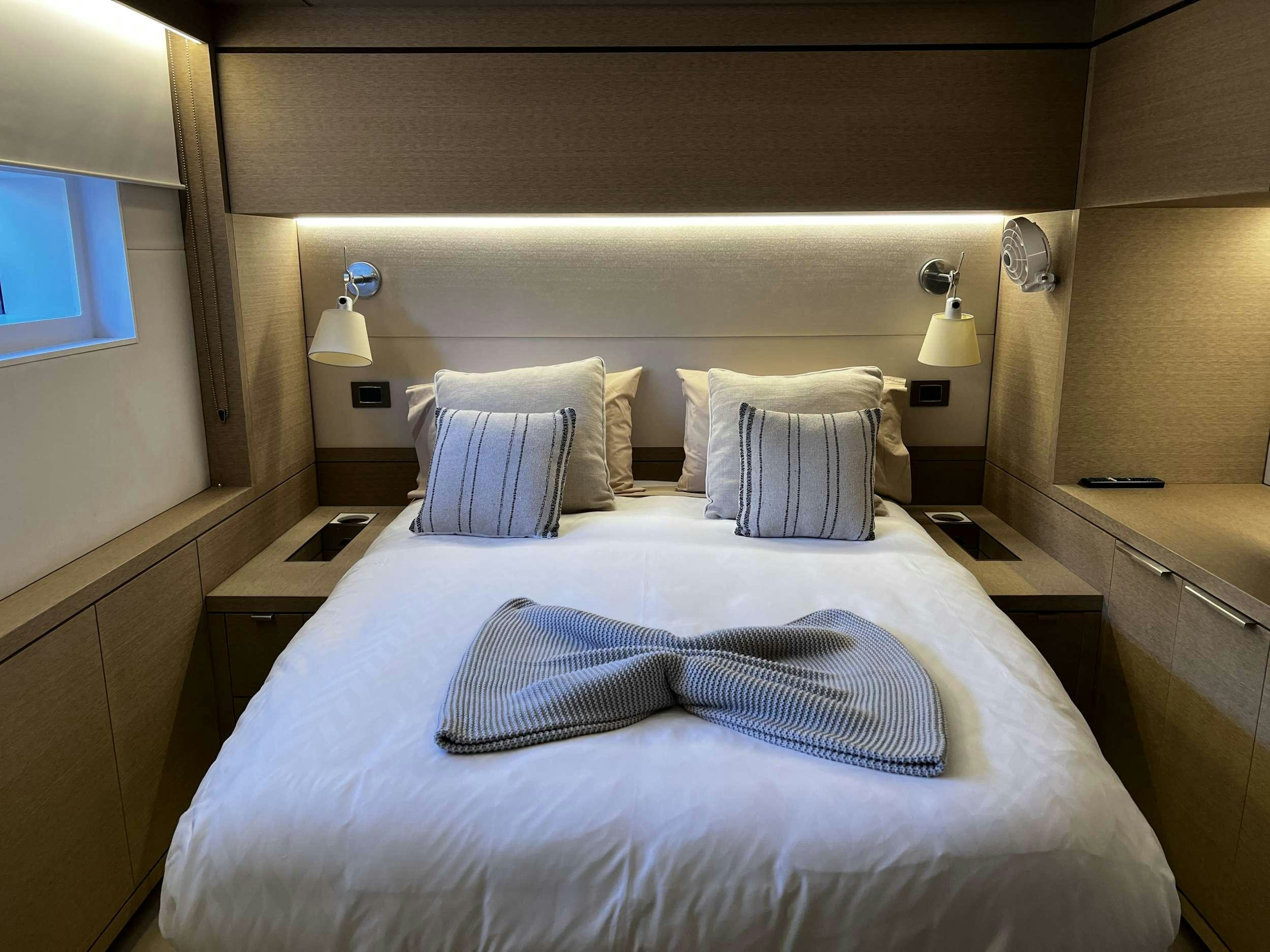 a bed with pillows aboard JUST MARIE 2 Yacht for Charter