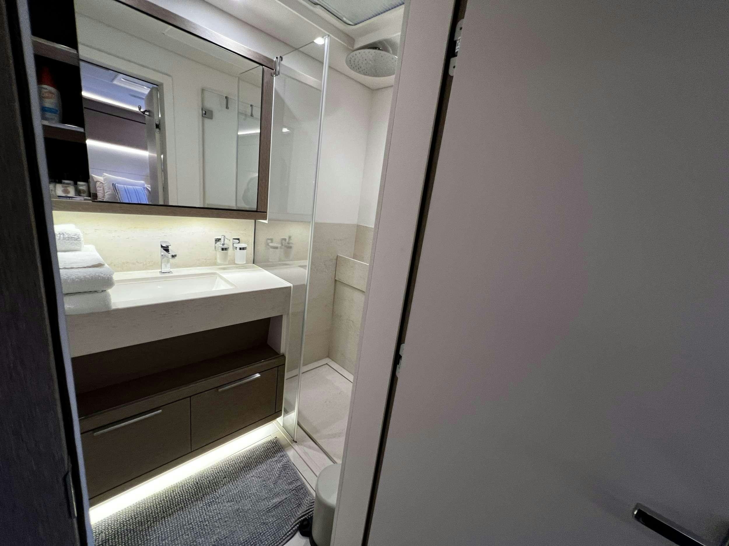 a bathroom with a sink and a mirror aboard JUST MARIE 2 Yacht for Charter