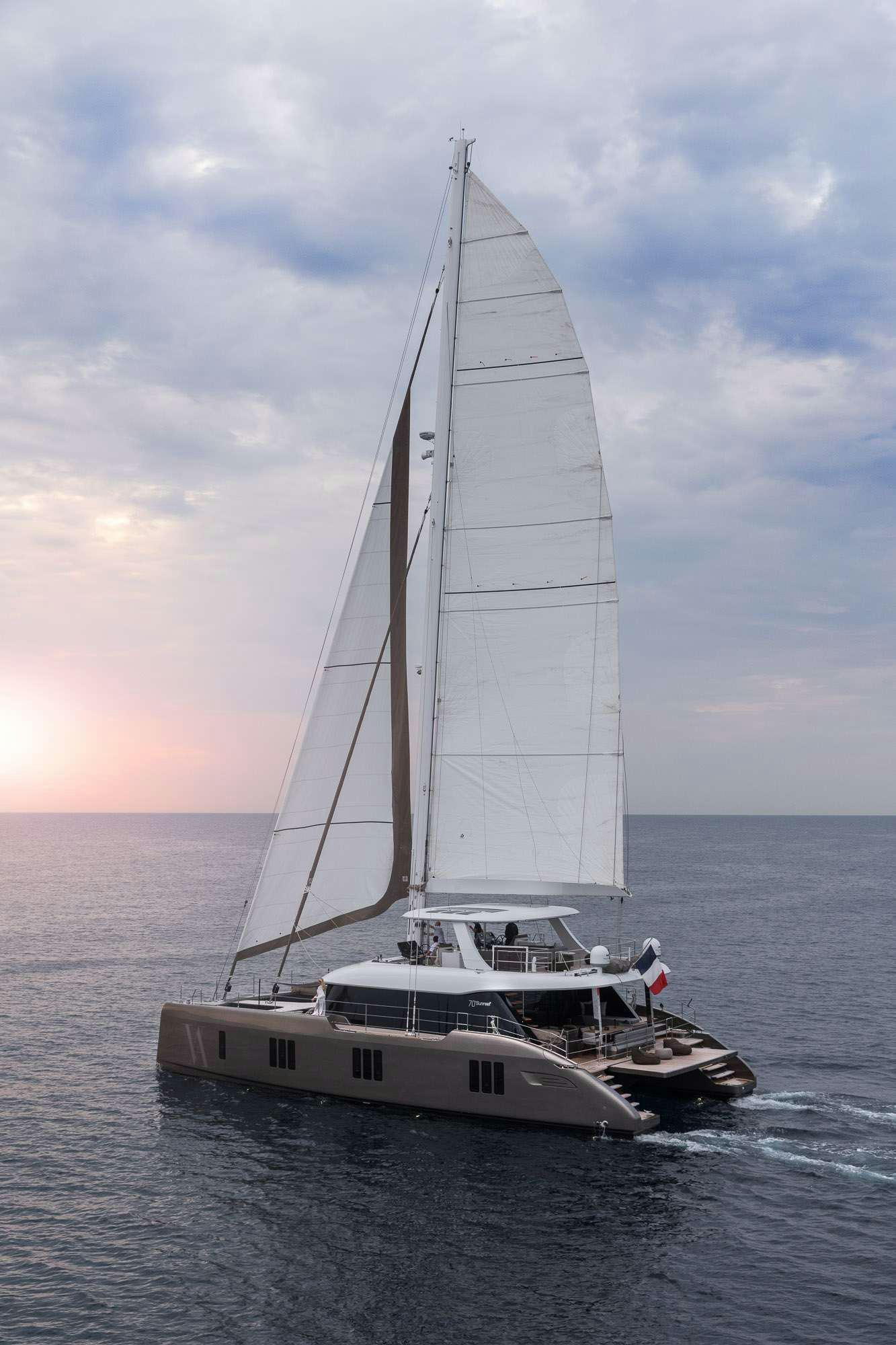 a white sailboat on the water aboard ANIMA Yacht for Charter