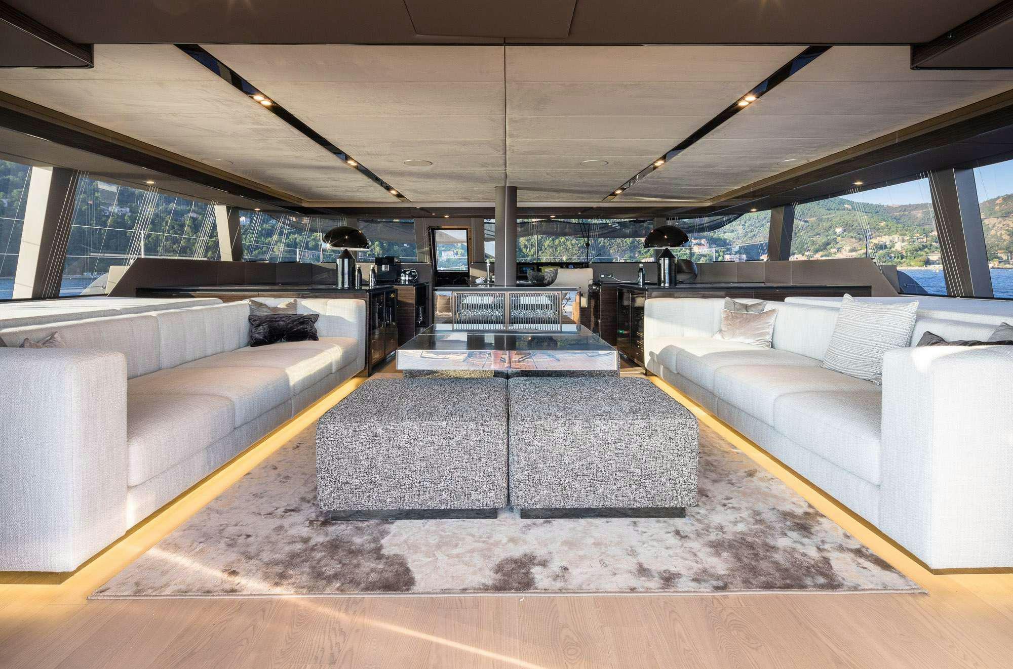 a room with couches and a table aboard ANIMA Yacht for Charter