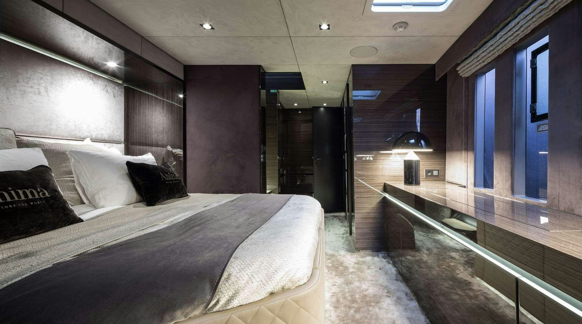 a bed in a room aboard ANIMA Yacht for Charter