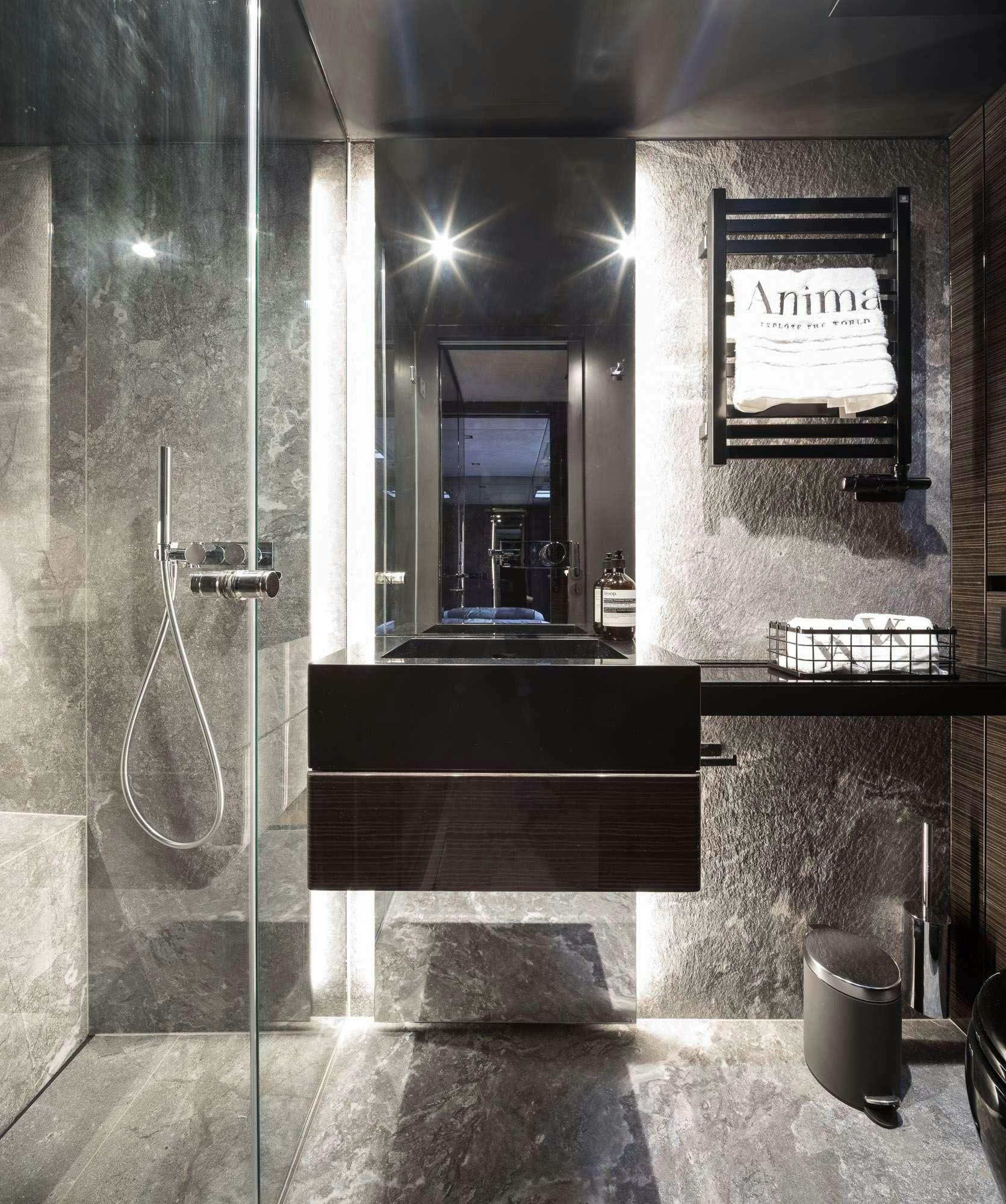 a bathroom with a glass shower aboard ANIMA Yacht for Charter