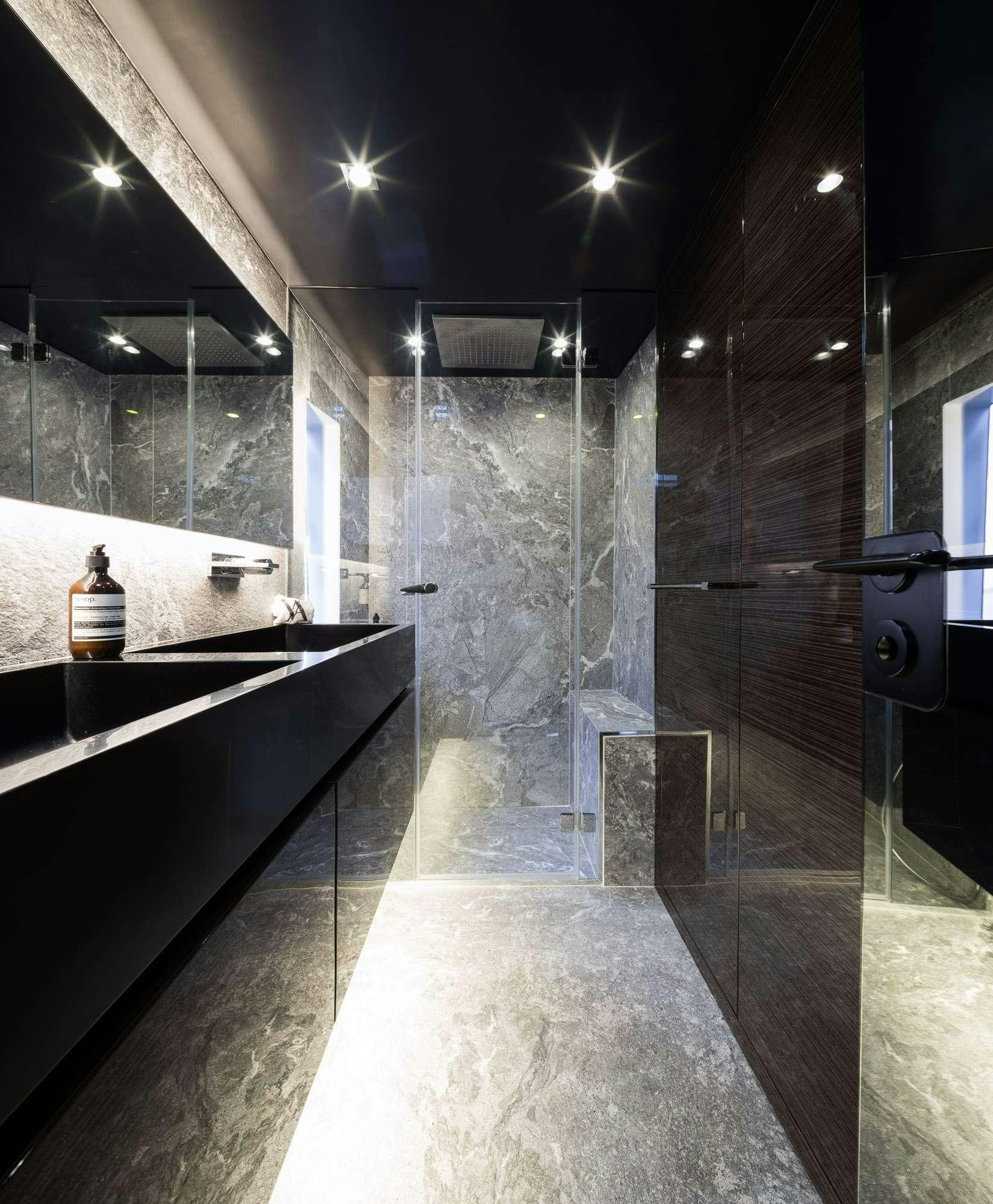 a bathroom with a tub and a sink aboard ANIMA Yacht for Charter