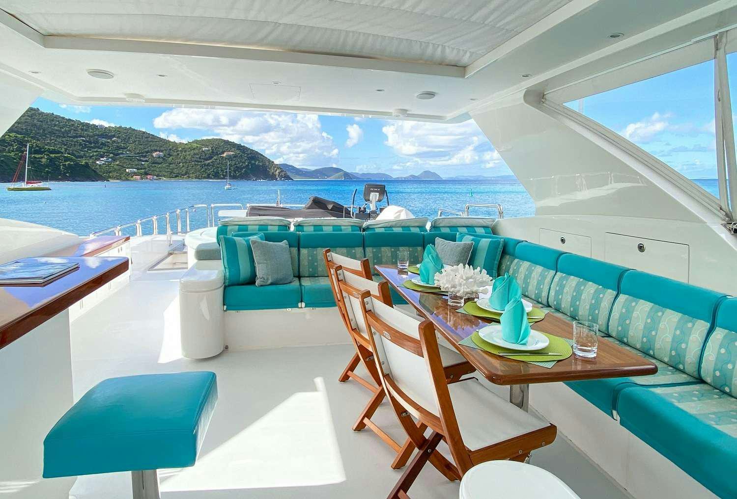 a table and chairs on a boat aboard CYNDERELLA Yacht for Charter