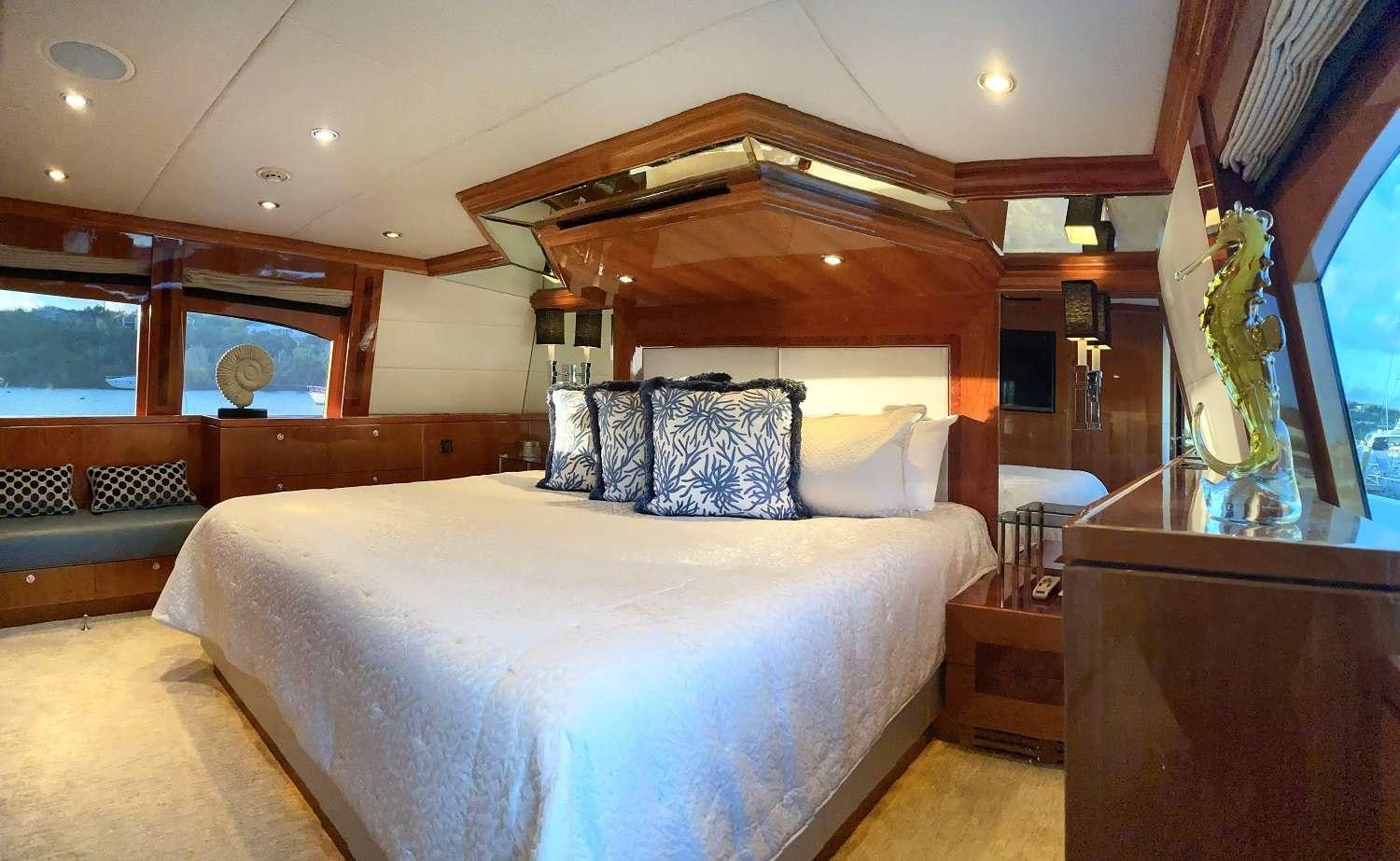 a large bed in a room aboard CYNDERELLA Yacht for Charter