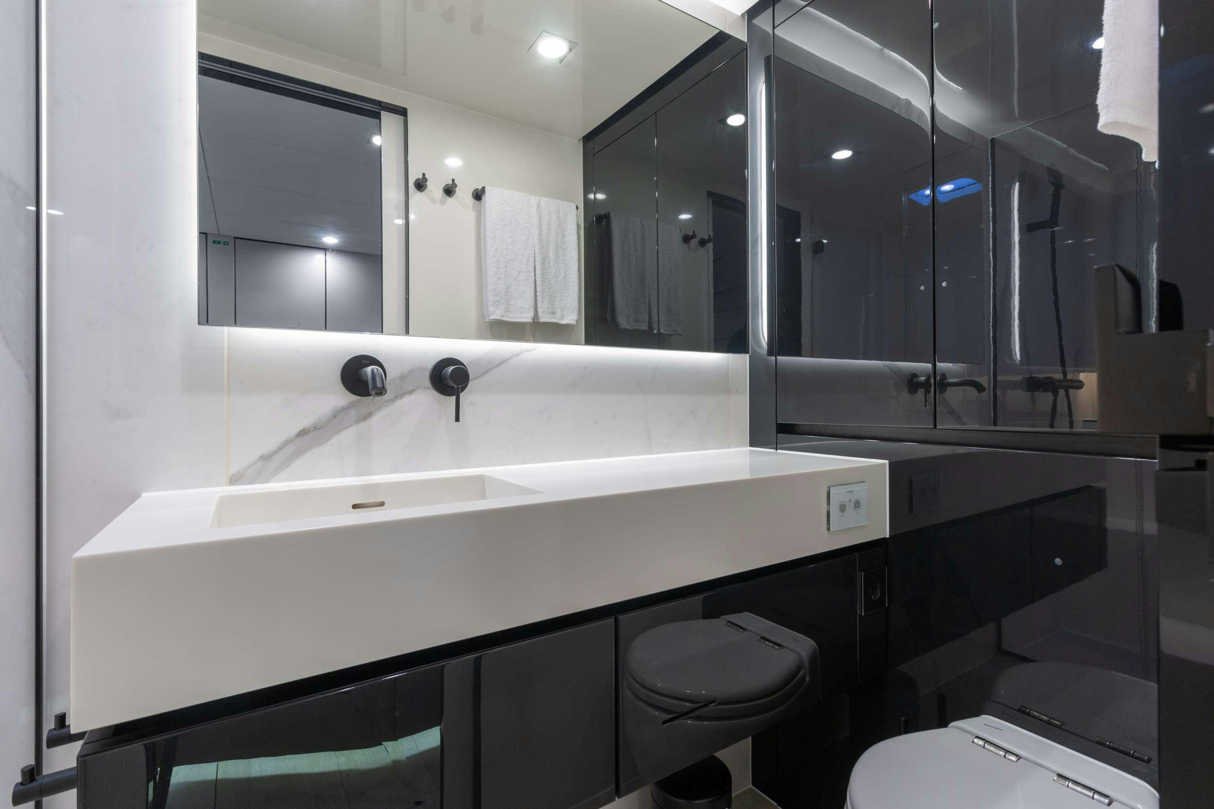 a bathroom with a large mirror aboard OCEAN VIBES Yacht for Charter