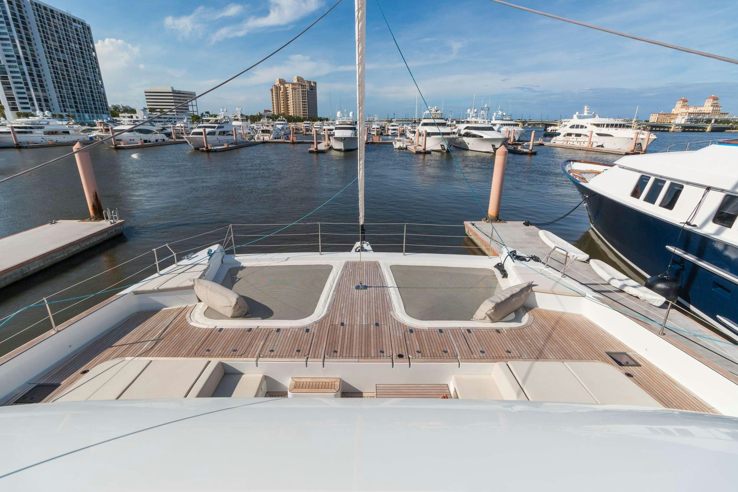 a boat dock with boats aboard OCEAN VIBES Yacht for Charter