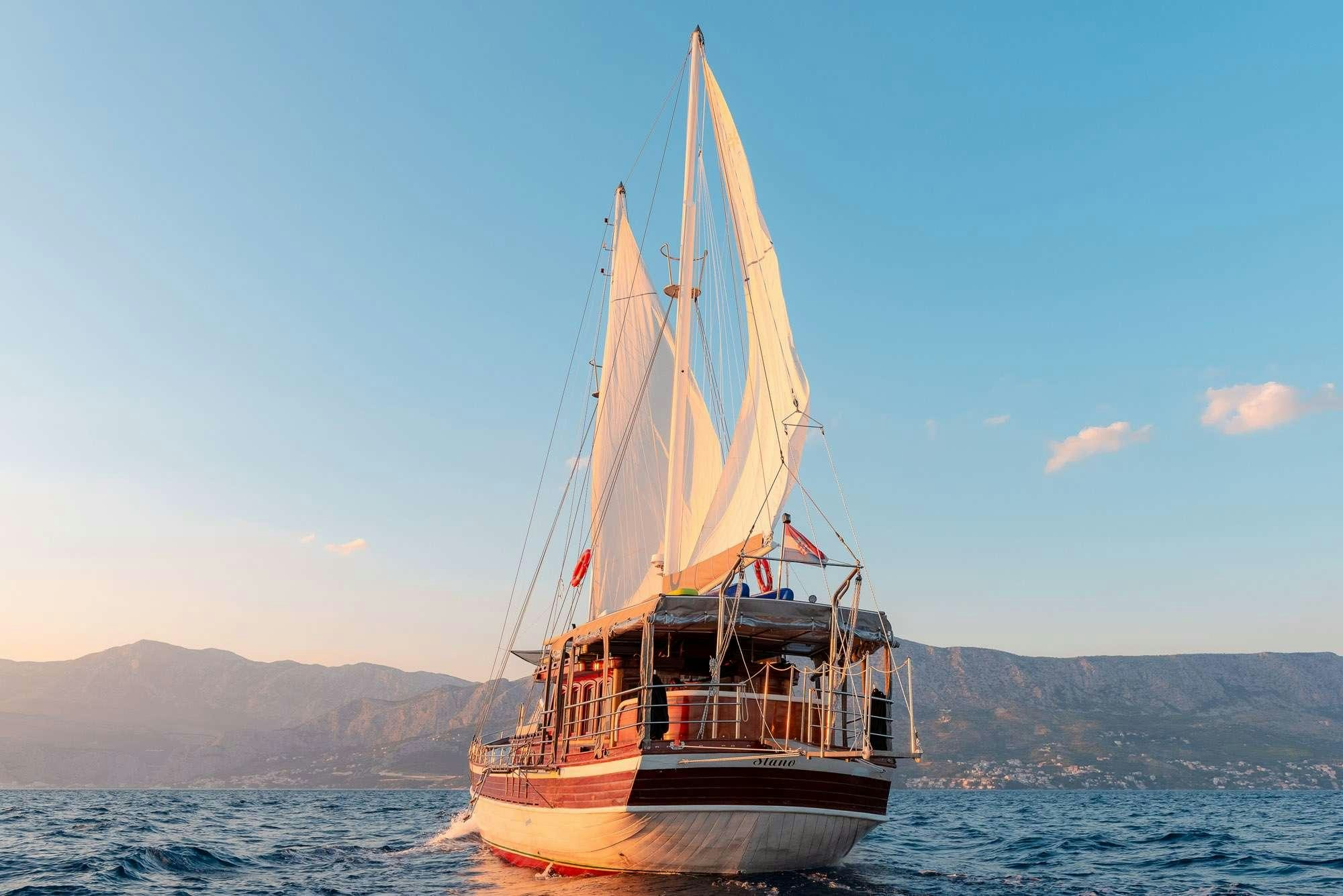 a sailboat on the water aboard SLANO Yacht for Charter