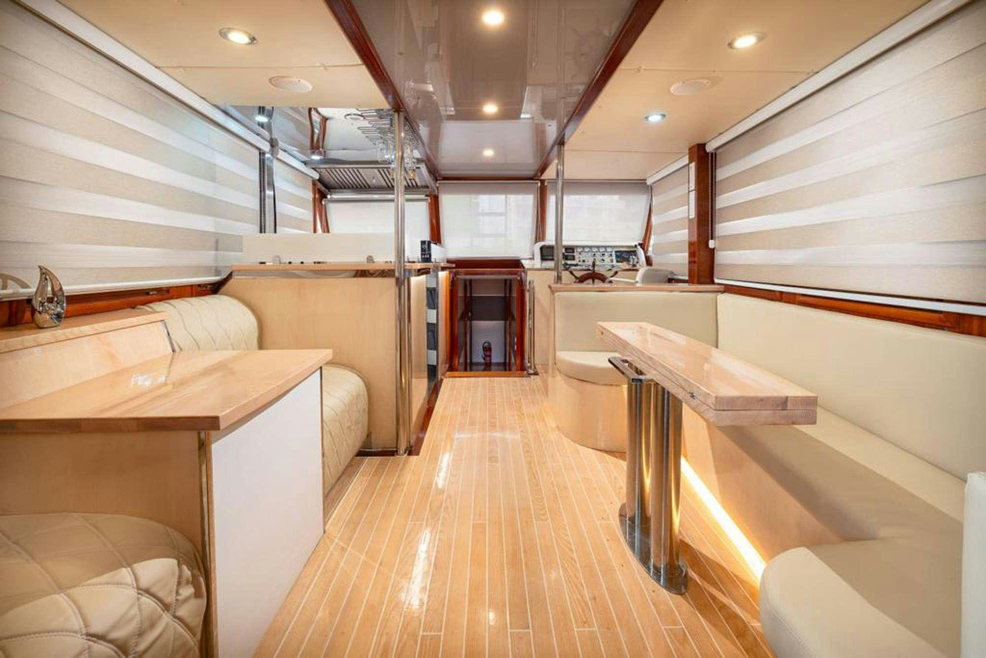 a large kitchen with wooden floors aboard SLANO Yacht for Charter