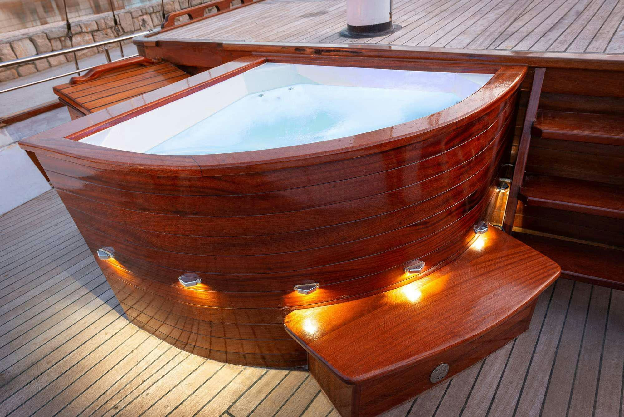 a circular object on a wood surface aboard SLANO Yacht for Charter
