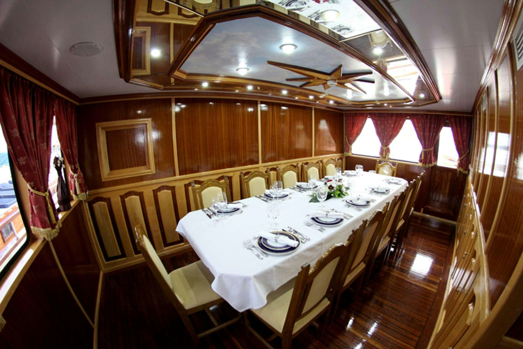 a dining table set for a dinner aboard KORAB Yacht for Charter