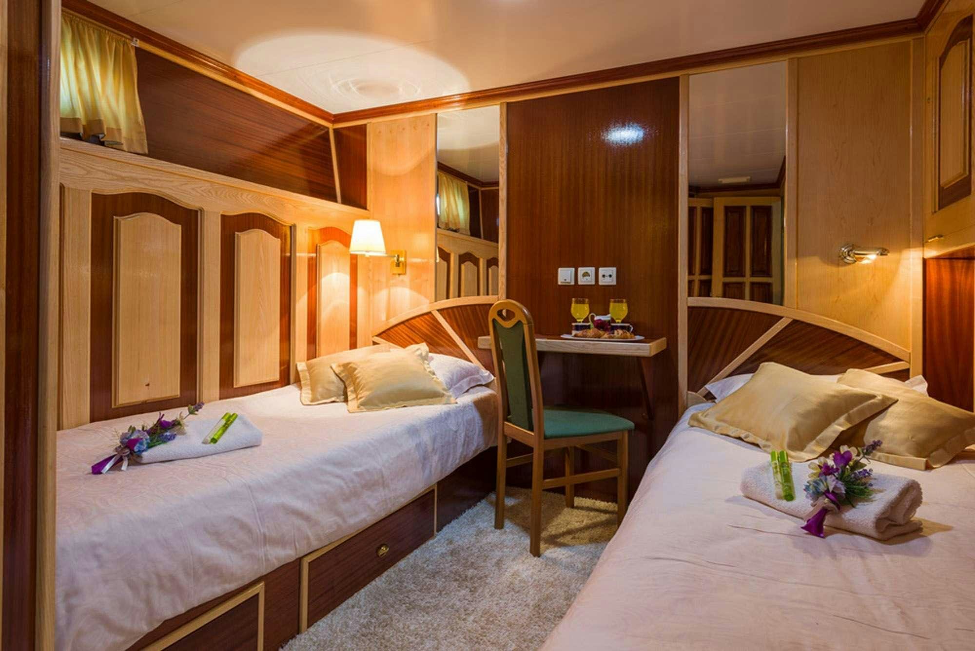 a room with two beds aboard KORAB Yacht for Charter