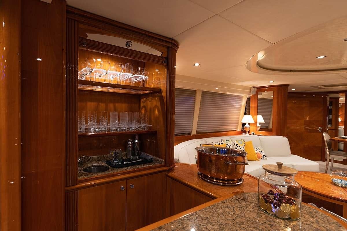 a kitchen with a large glass shelf aboard ENDLESS SUN Yacht for Charter