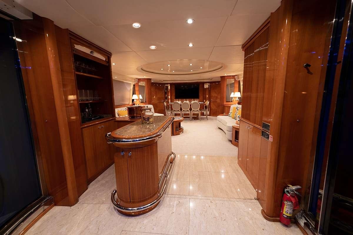 a large room with a table and chairs aboard ENDLESS SUN Yacht for Charter