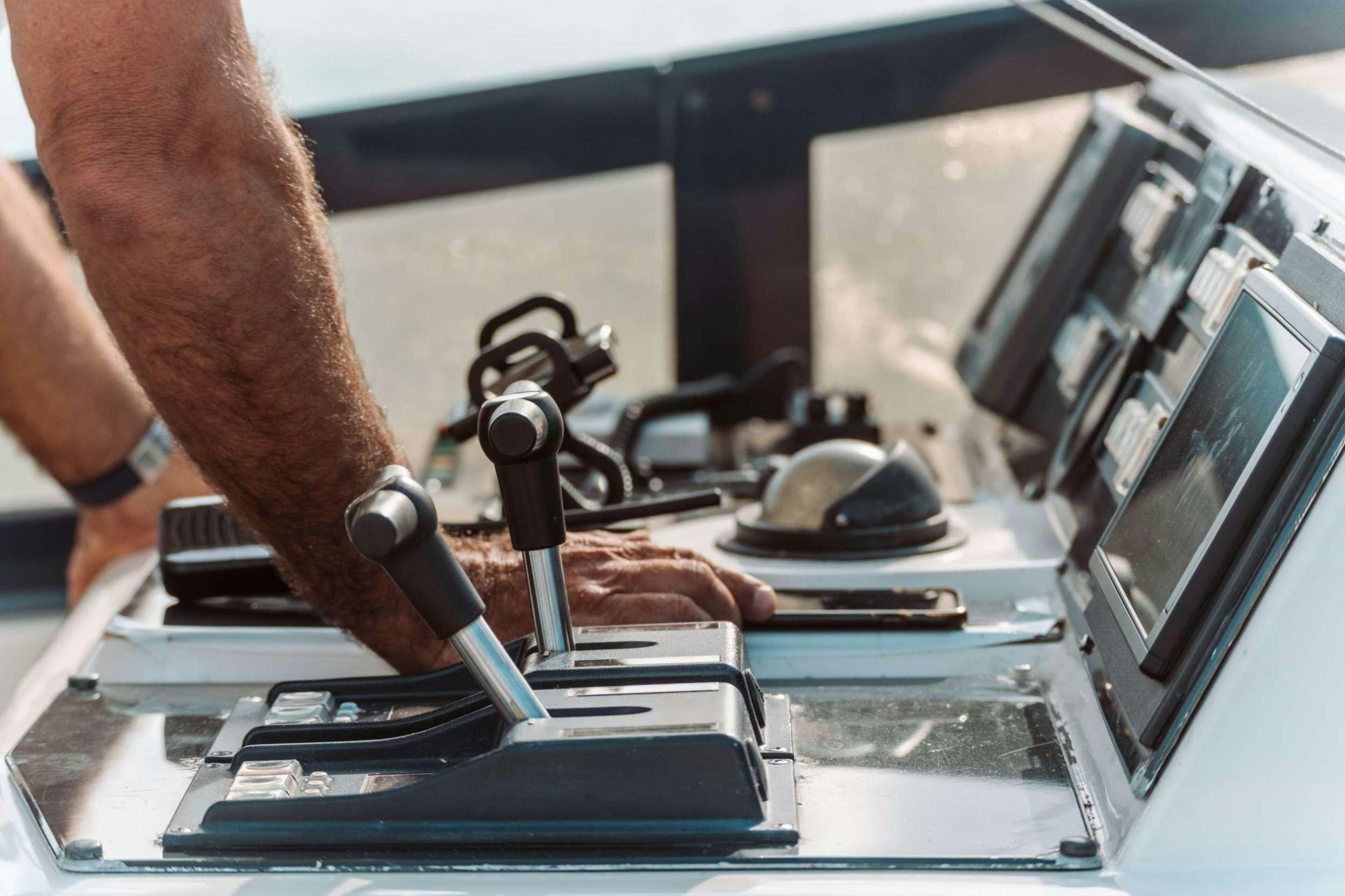 a man working on a computer aboard ENDLESS SUN Yacht for Charter