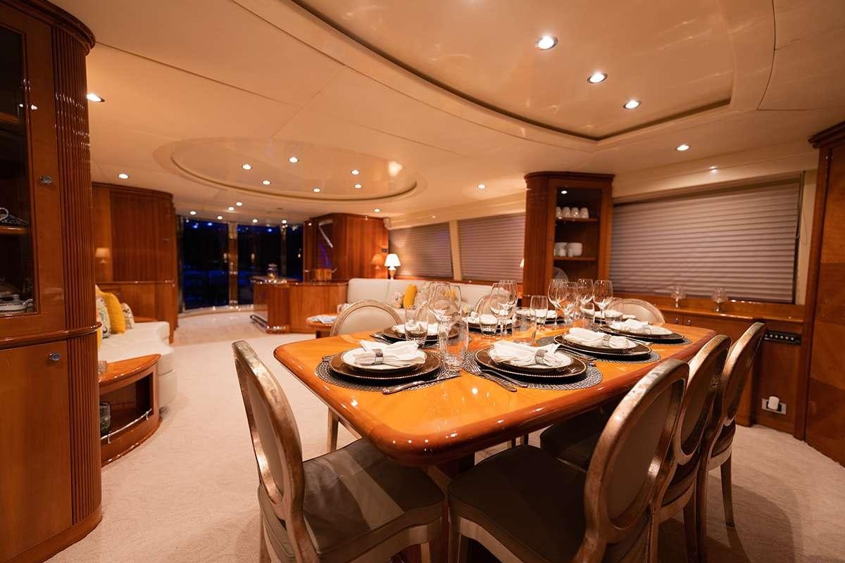 a dining room with a table set for dinner aboard ENDLESS SUN Yacht for Charter