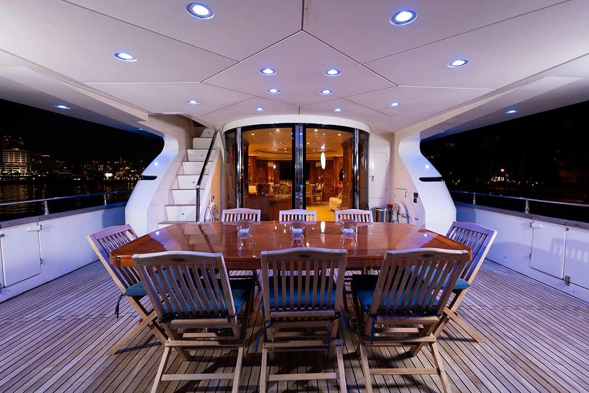 a room with tables and chairs aboard ENDLESS SUN Yacht for Charter