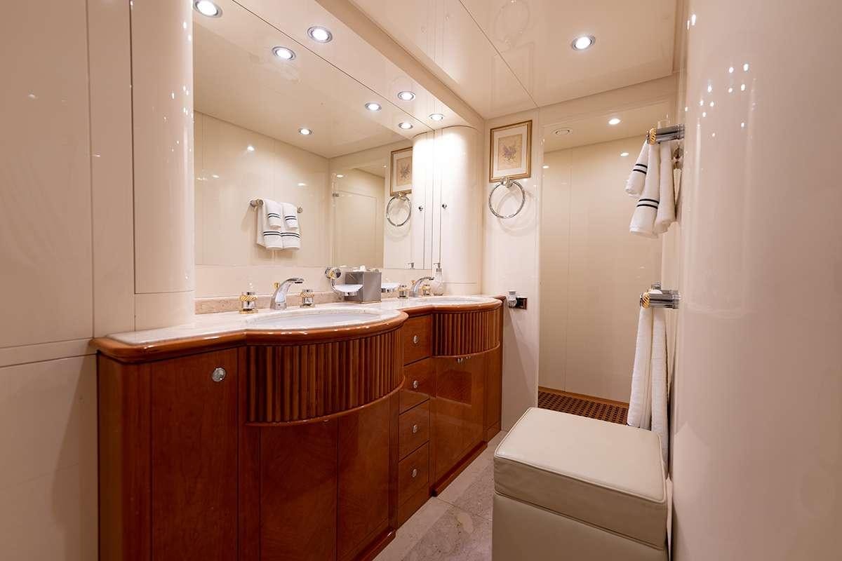 a bathroom with a sink and a mirror aboard ENDLESS SUN Yacht for Charter