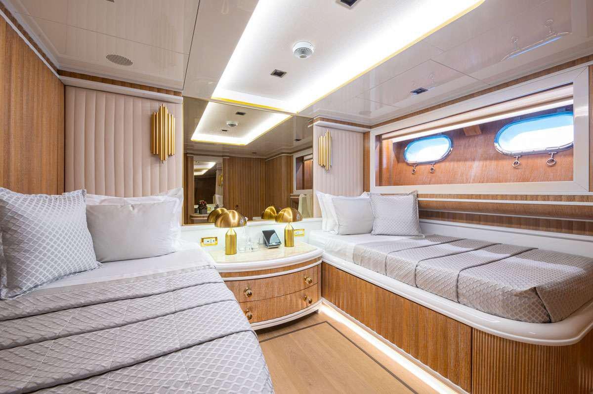 a room with two beds aboard BARENTS Yacht for Charter