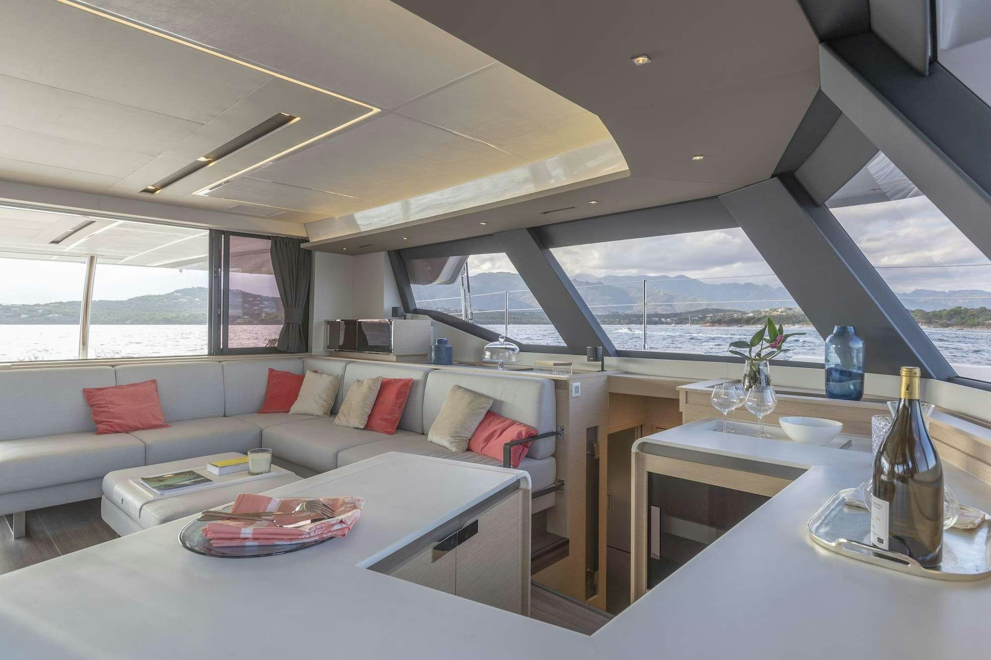 a living room with a large glass window aboard ALEXANDRA II Yacht for Charter