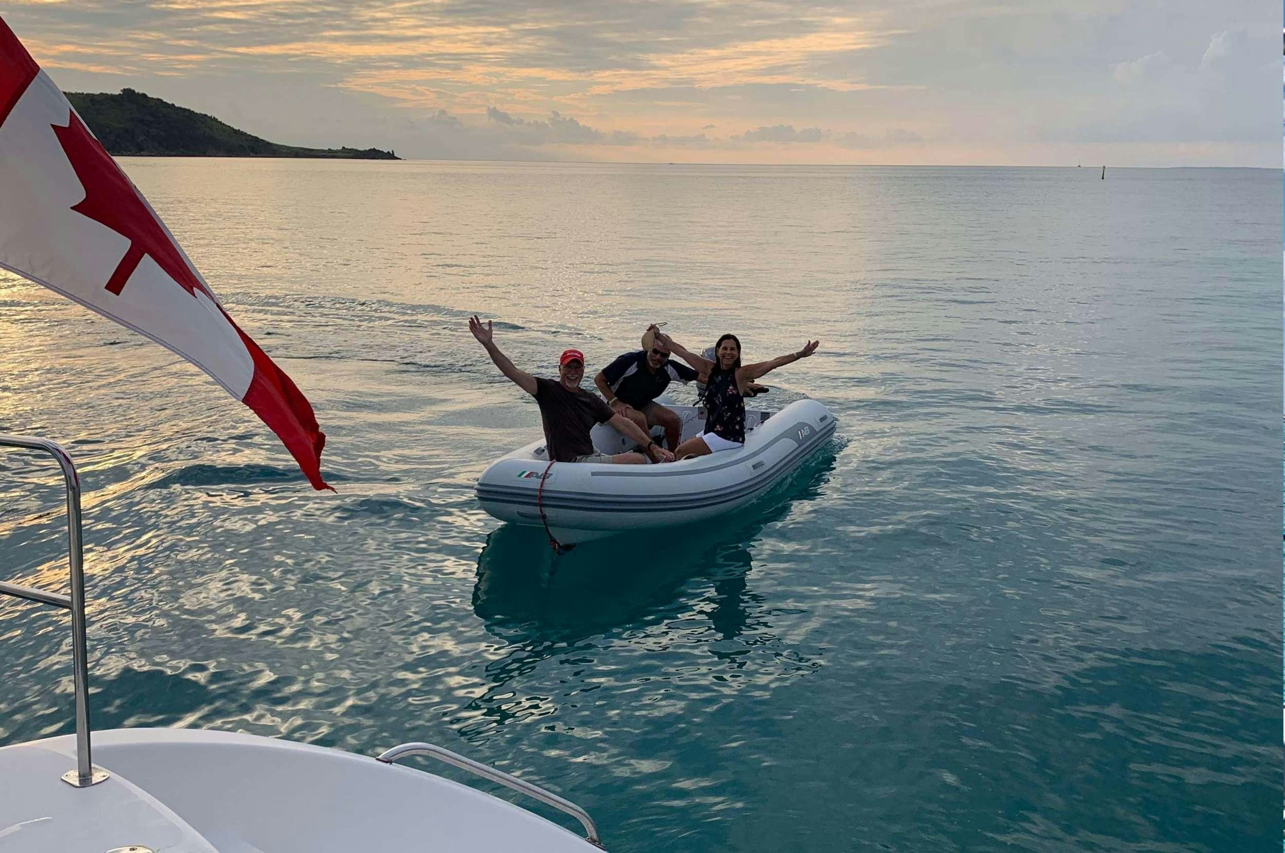 a group of people on a boat aboard Genesis II Yacht for Charter