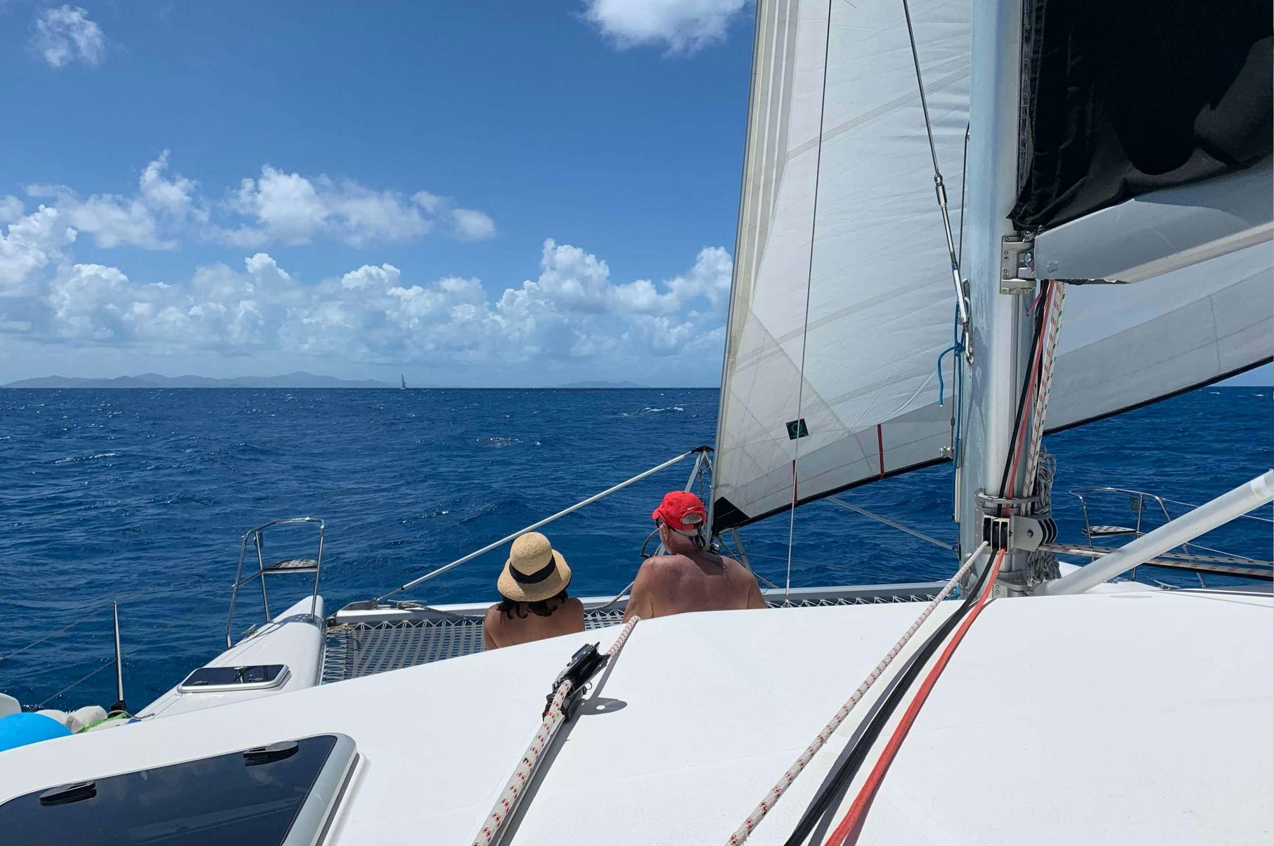 a couple of people on a boat aboard Genesis II Yacht for Charter