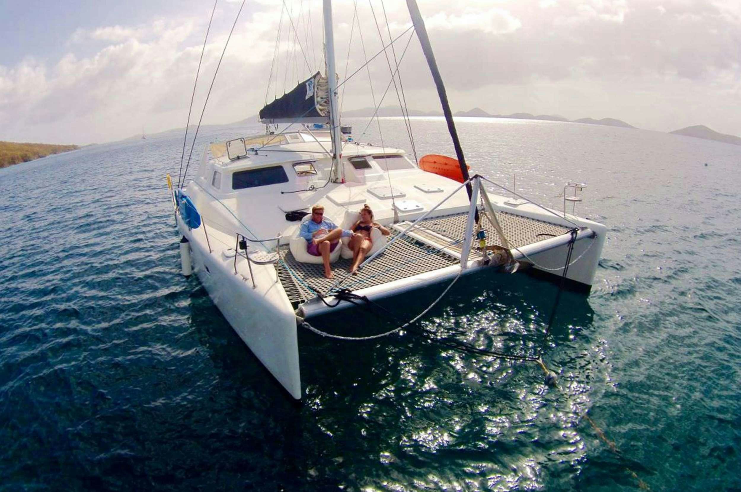 a couple of people on a boat aboard Genesis II Yacht for Charter