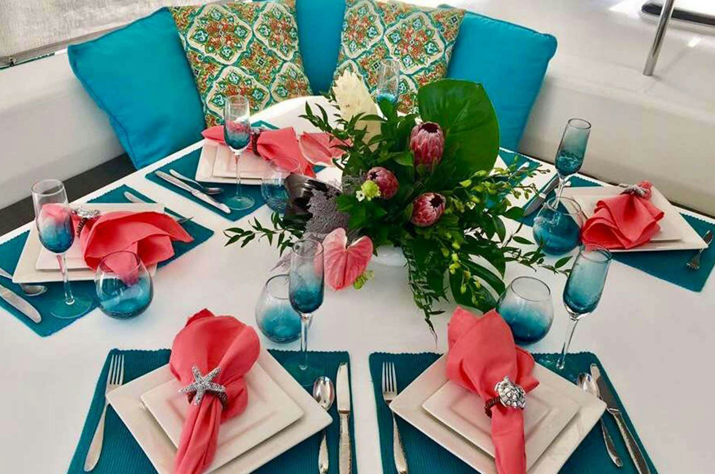 a table with place settings aboard Genesis II Yacht for Charter