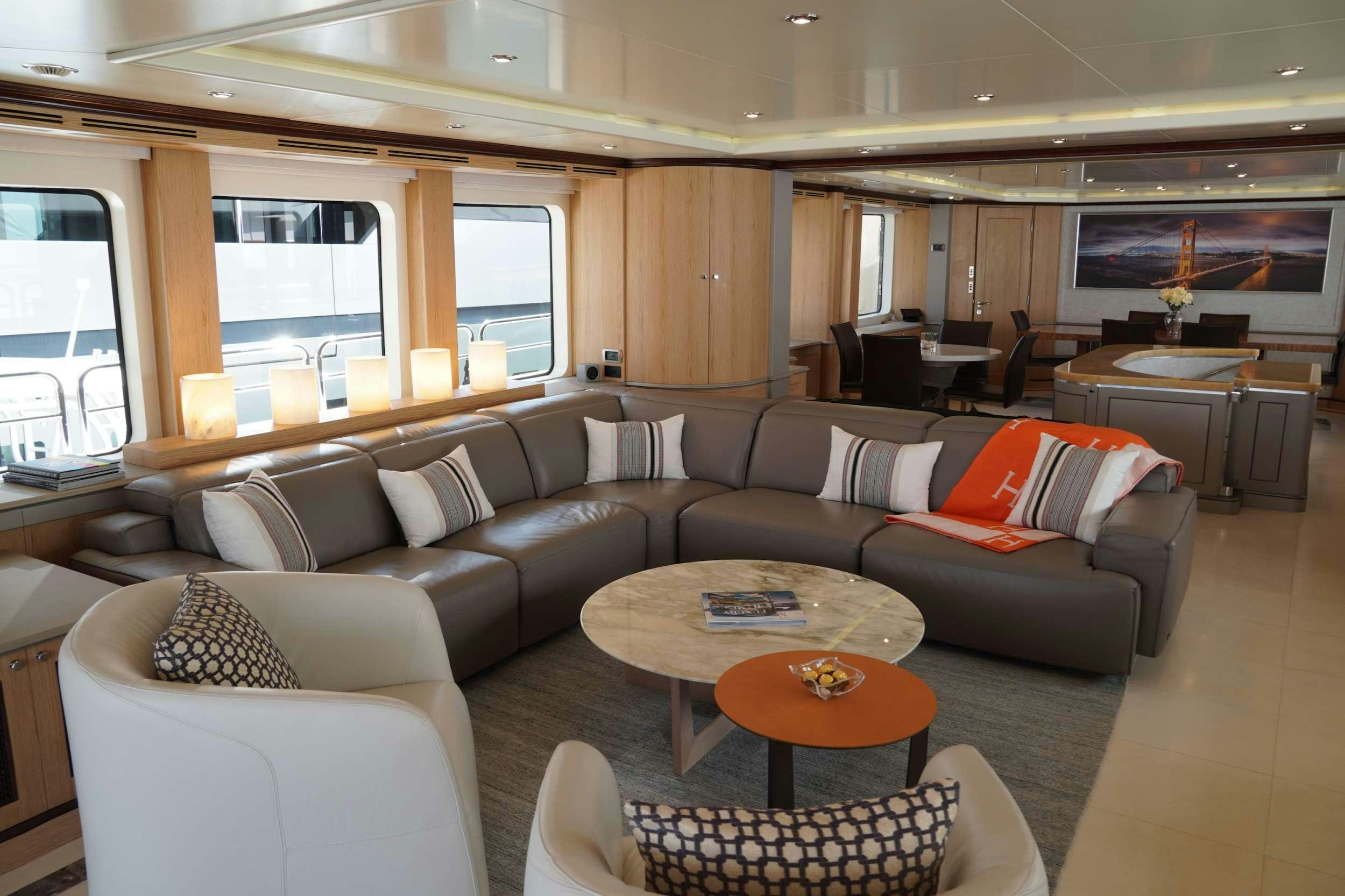 a living room with a couch and a coffee table aboard PAPAITO Yacht for Charter