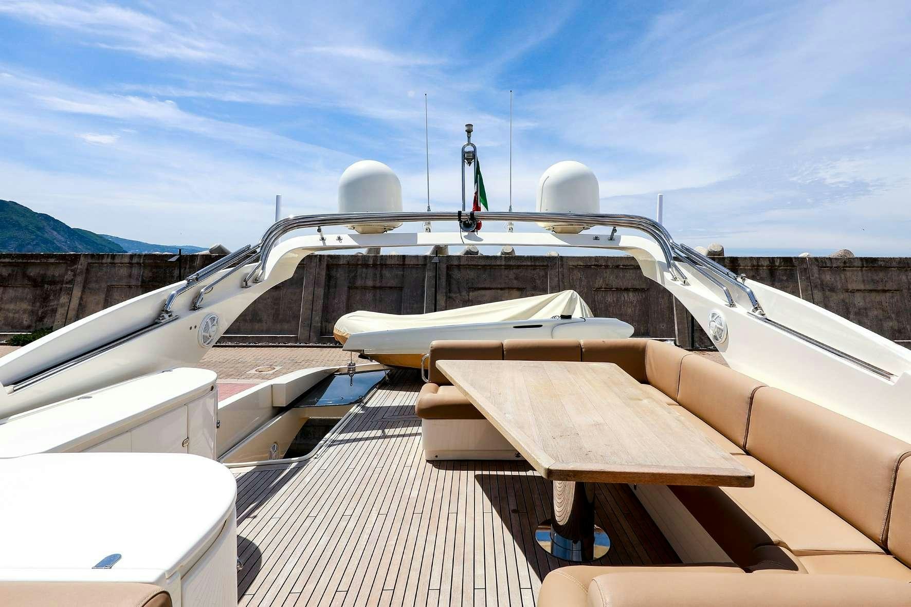 a boat with a statue on the deck aboard JOY Yacht for Charter