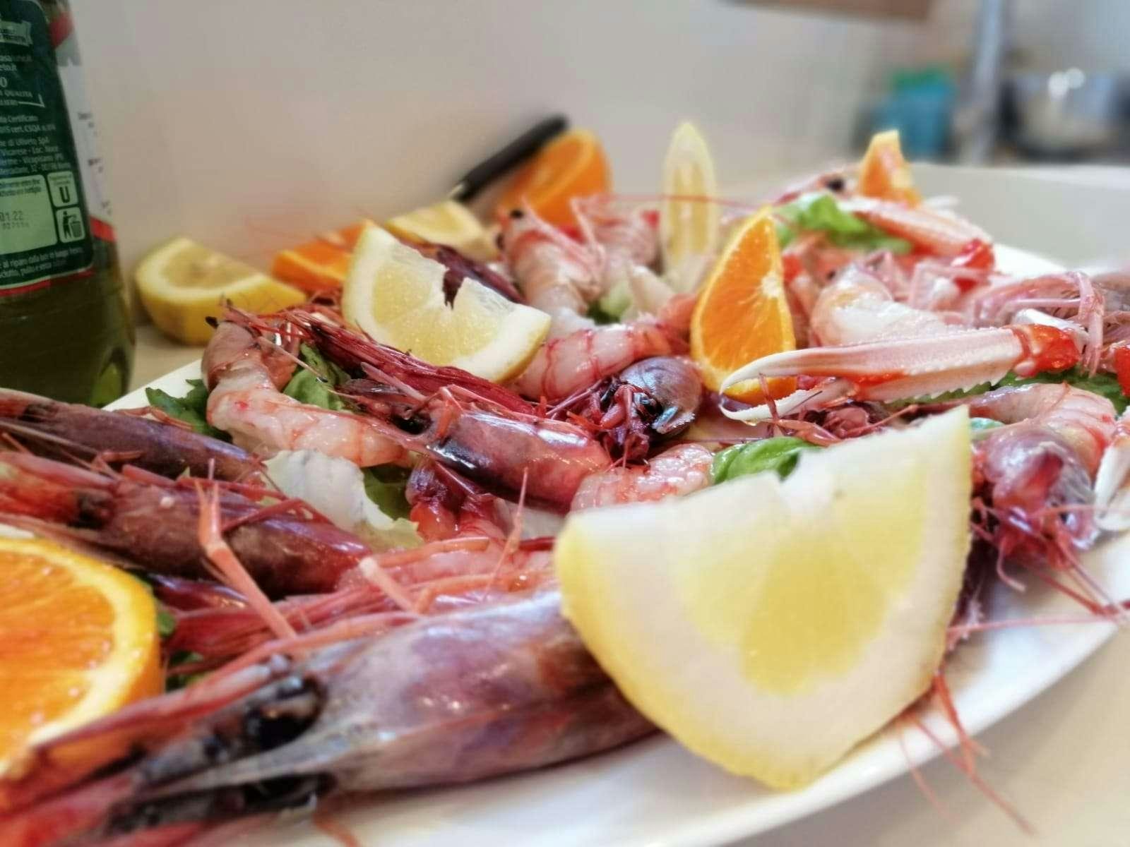 a plate of seafood aboard JOY Yacht for Charter
