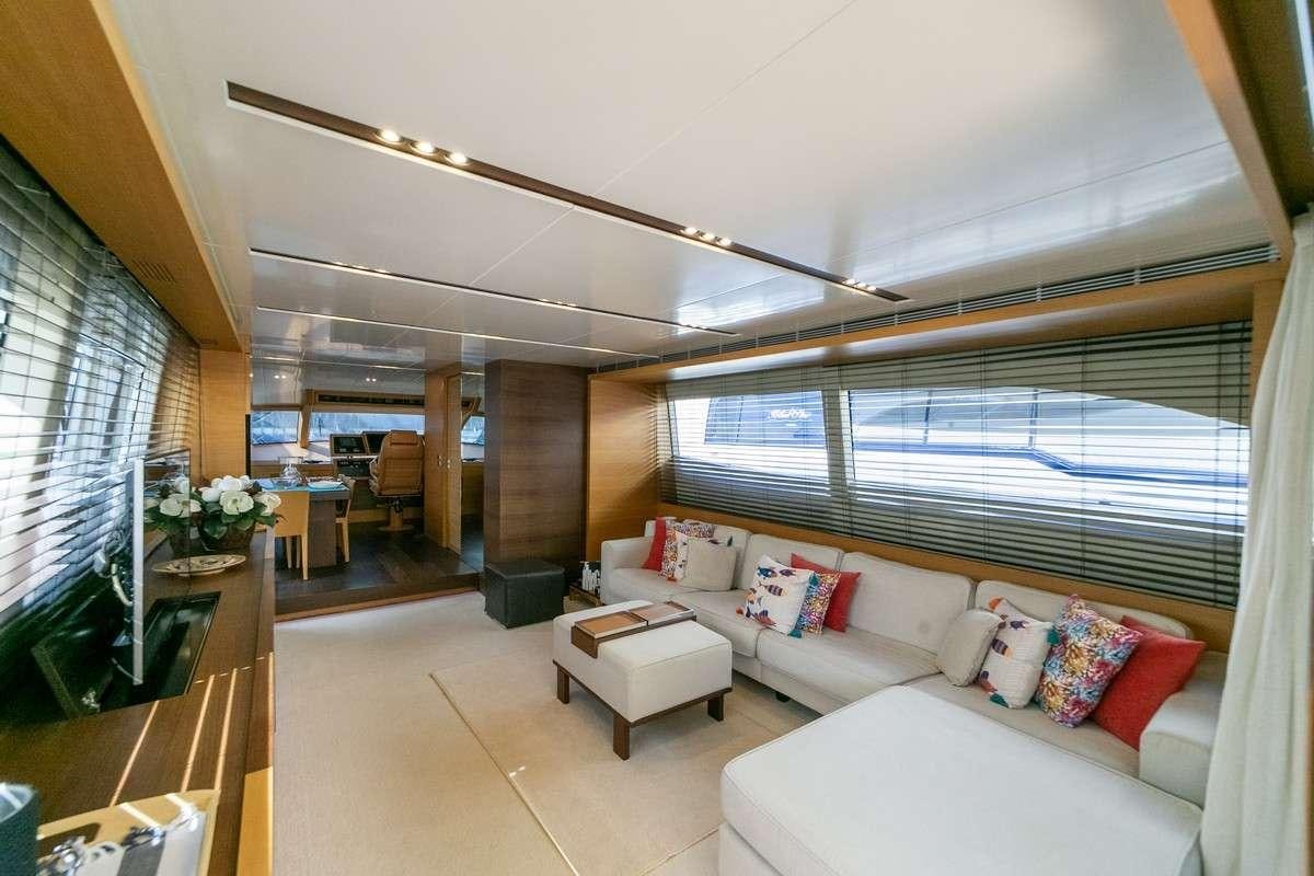 a living room with a large window aboard MISS CAROLINA Yacht for Charter