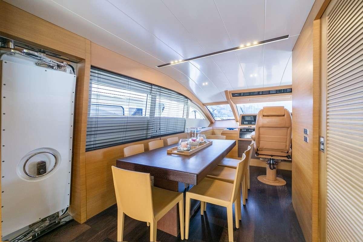 a room with a table and chairs aboard MISS CAROLINA Yacht for Charter