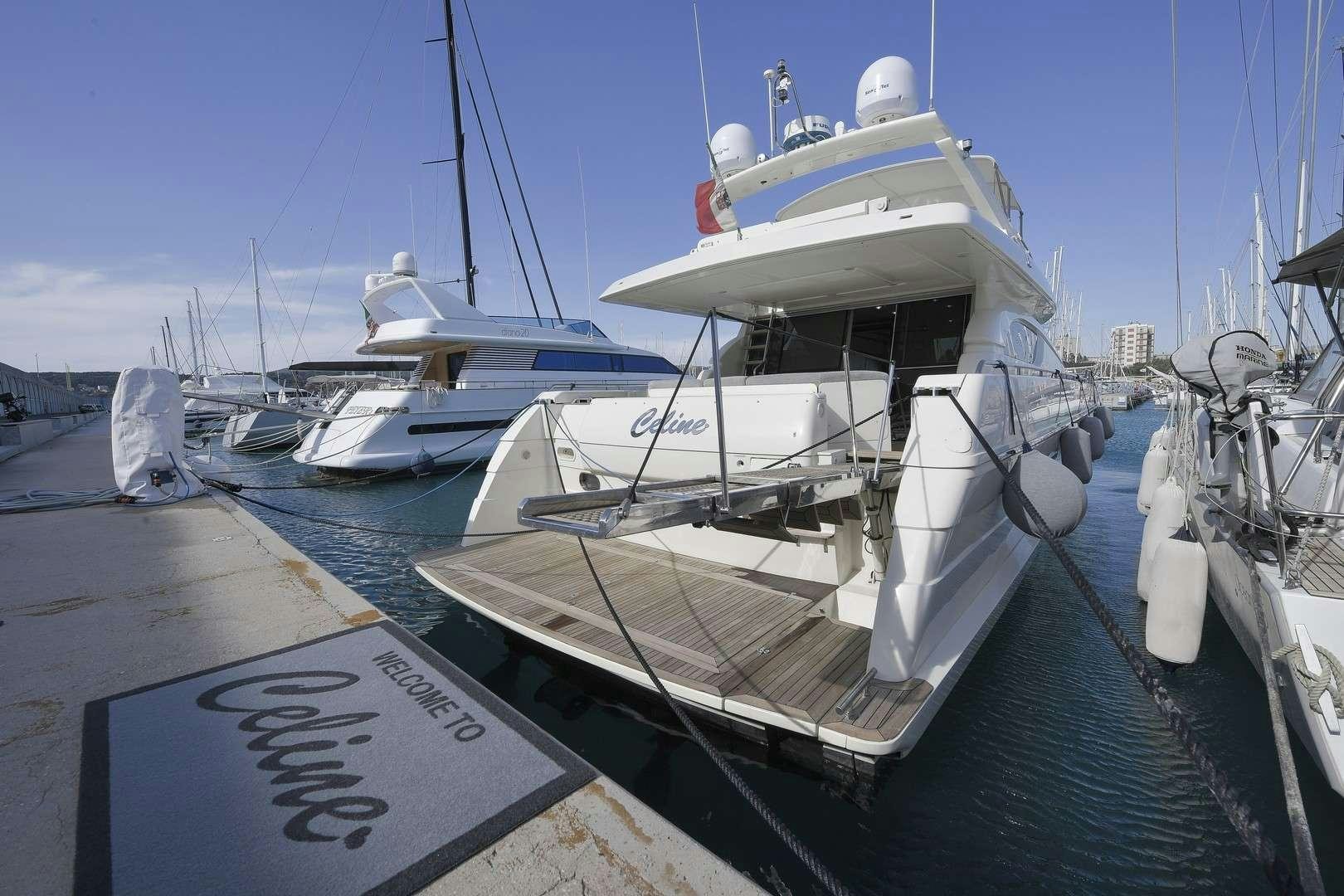 a boat docked at a pier aboard Celine Yacht for Charter
