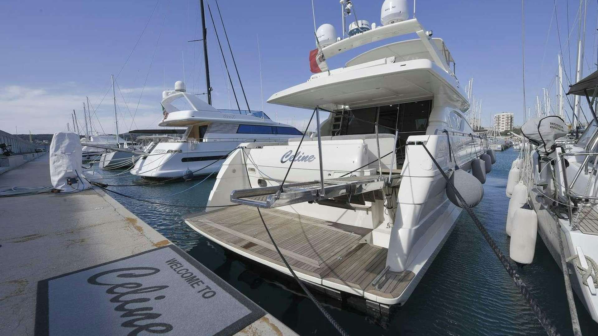a boat docked at a pier aboard Celine Yacht for Charter