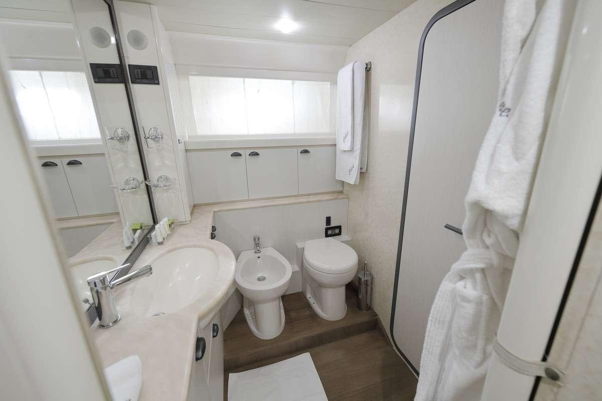a bathroom with a sink toilet and a bathtub aboard Celine Yacht for Charter