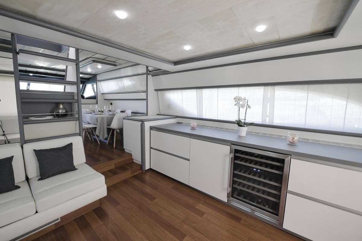a large kitchen with a large island aboard Celine Yacht for Charter