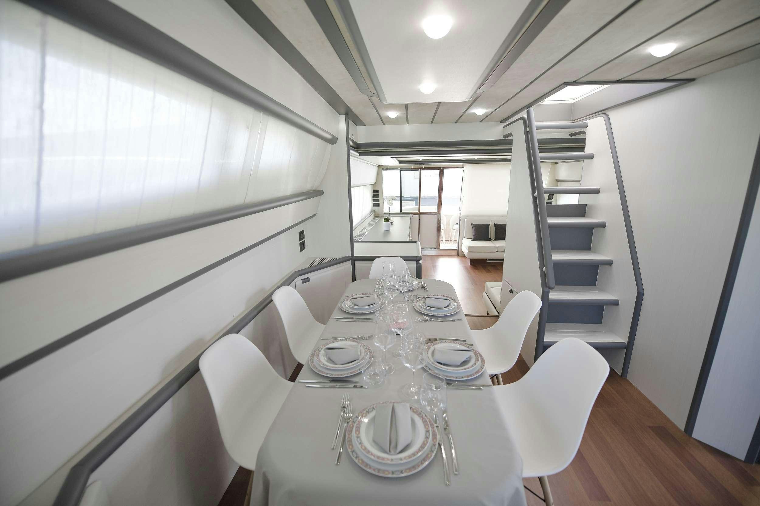 a dining table in a room aboard Celine Yacht for Charter