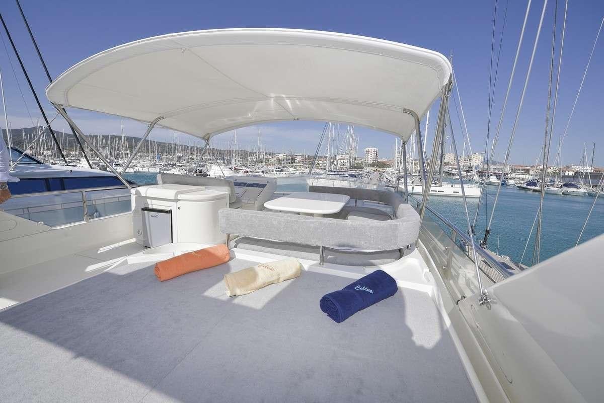 a boat docked at a pier aboard Celine Yacht for Charter