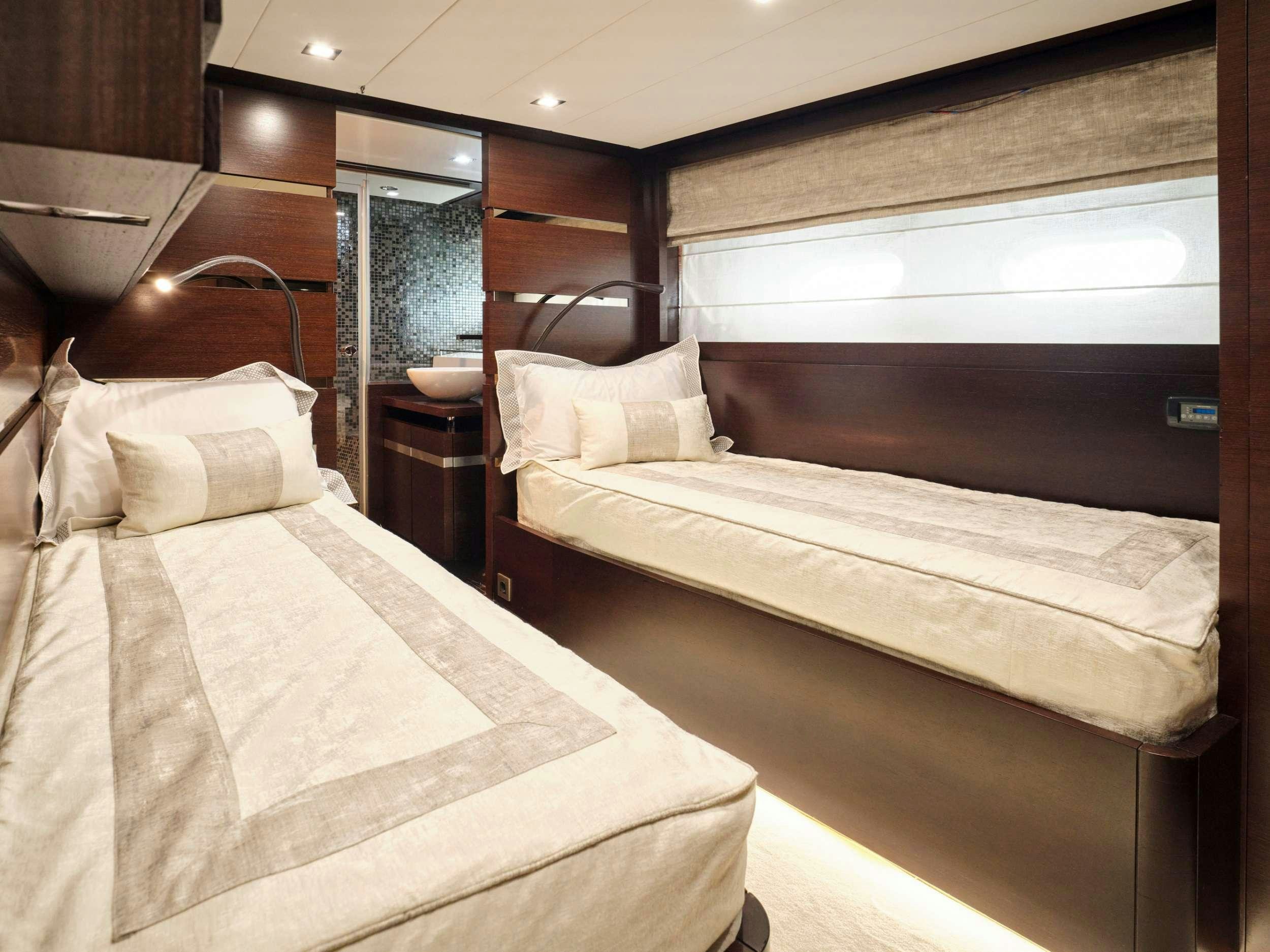 a couple of beds in a room aboard HAKUNA MATATA Yacht for Charter