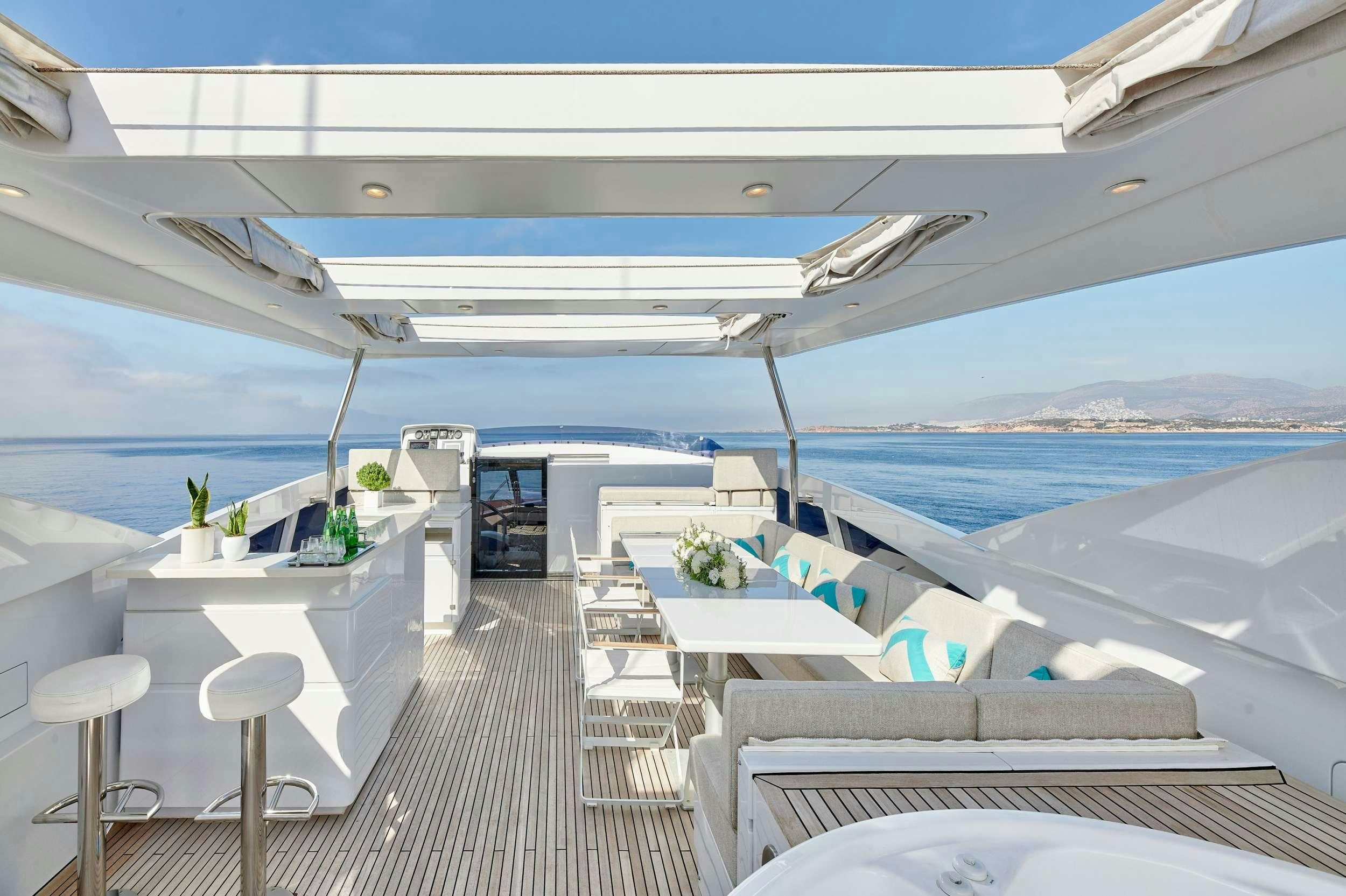 a large white building with a balcony aboard HAKUNA MATATA Yacht for Charter