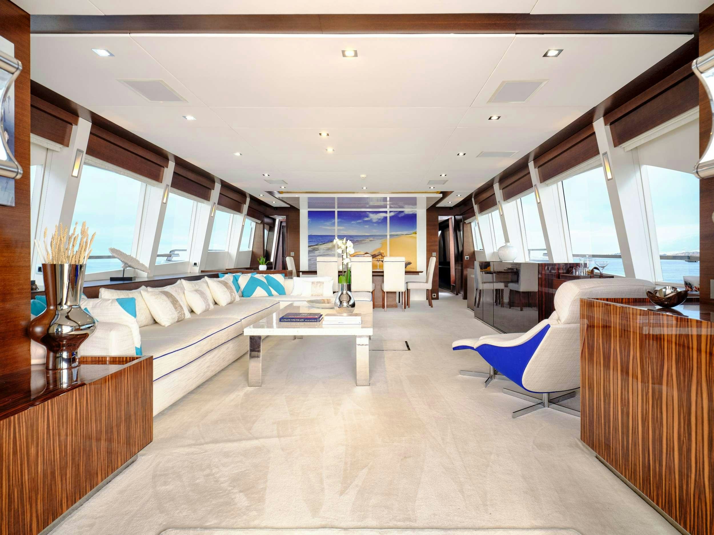 a large room with a couch and a table aboard HAKUNA MATATA Yacht for Charter