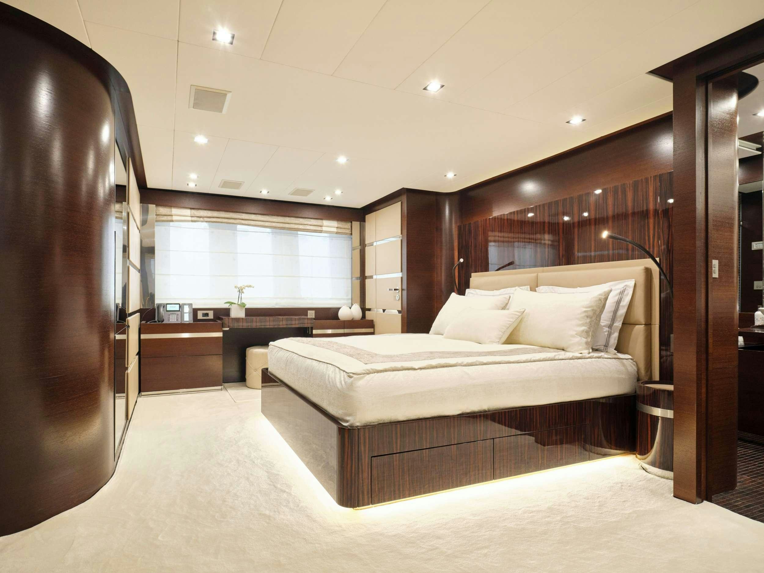 a large bedroom with a large bed aboard HAKUNA MATATA Yacht for Charter