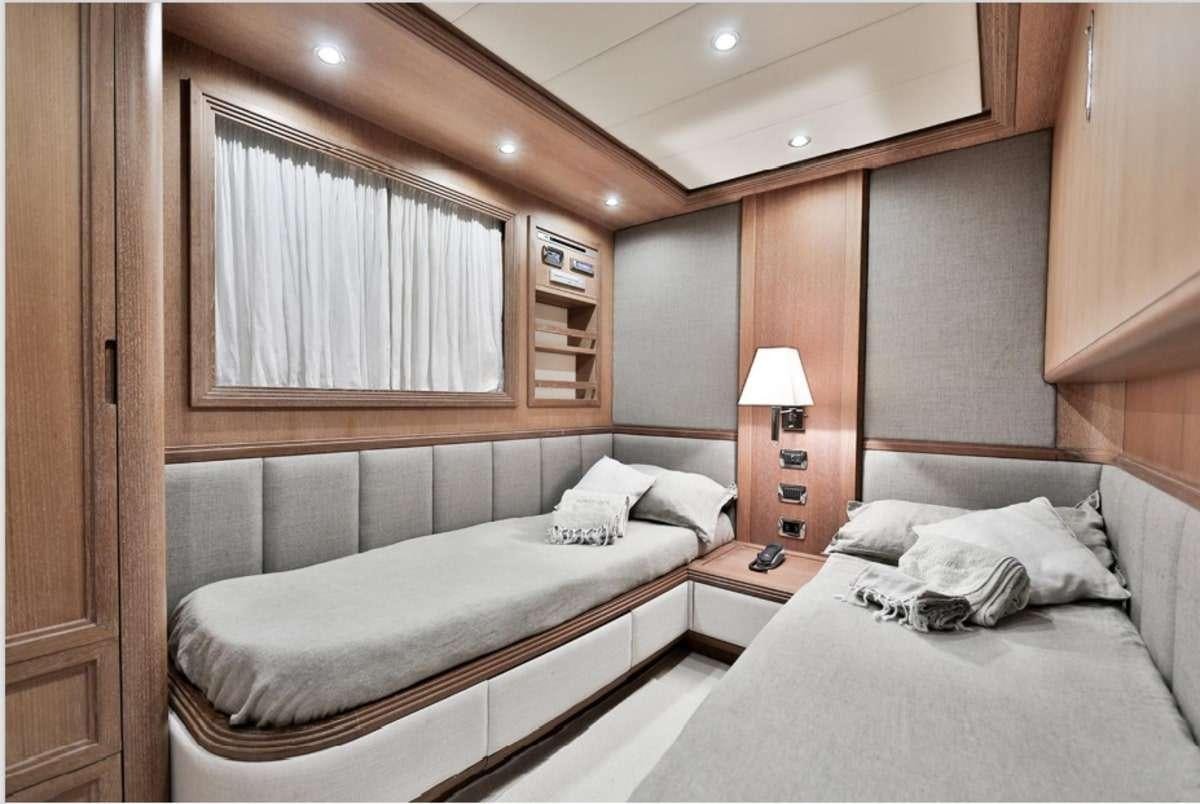 a couple of beds in a room aboard RESILIENCE Yacht for Charter