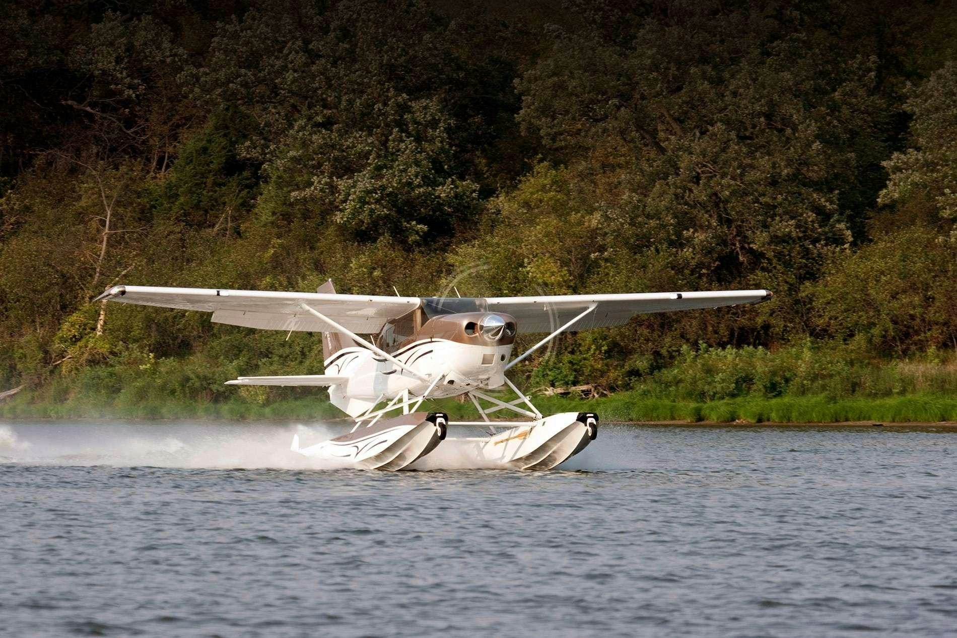a plane flying over water aboard RESILIENCE Yacht for Charter