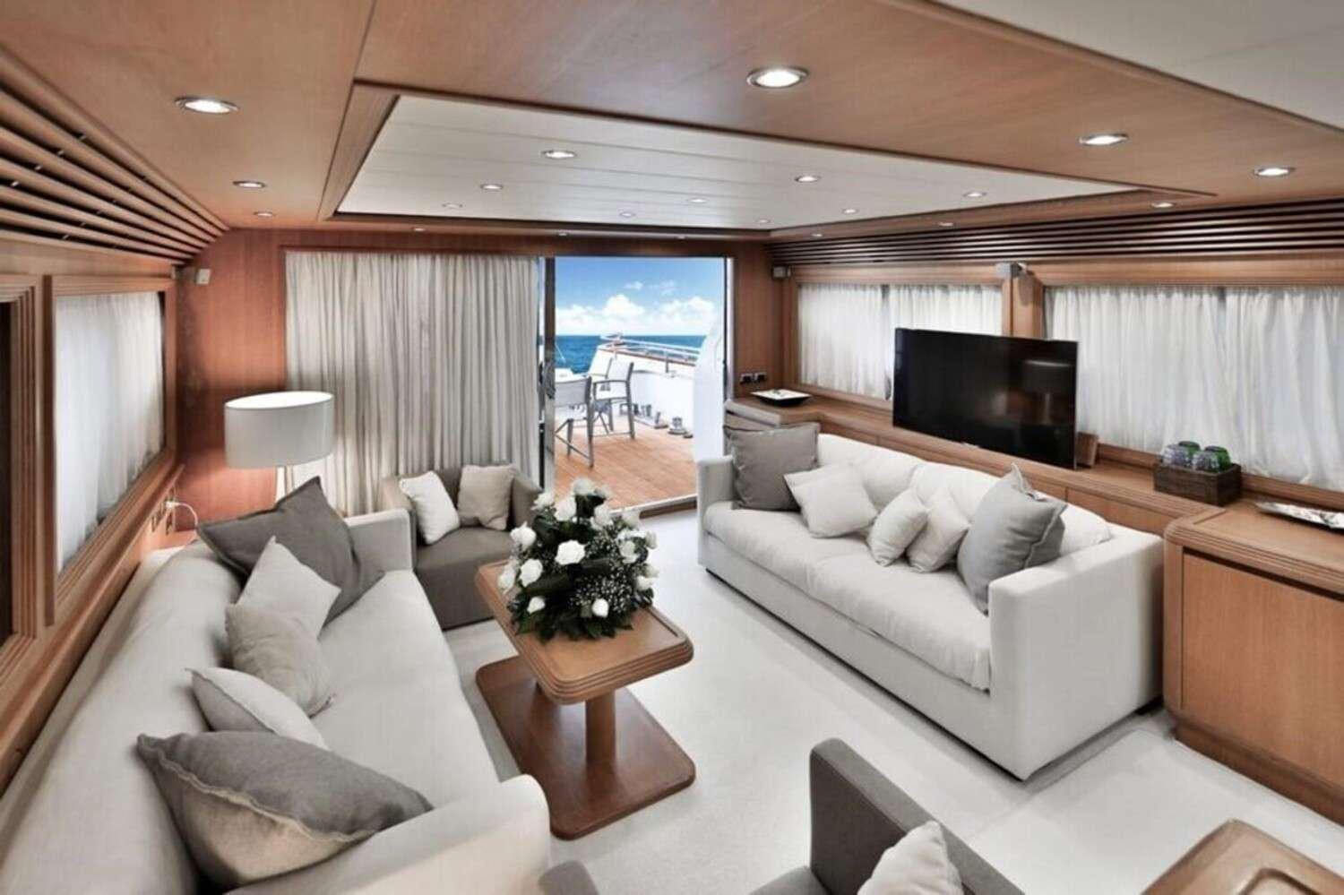 a living room with a large window aboard RESILIENCE Yacht for Charter