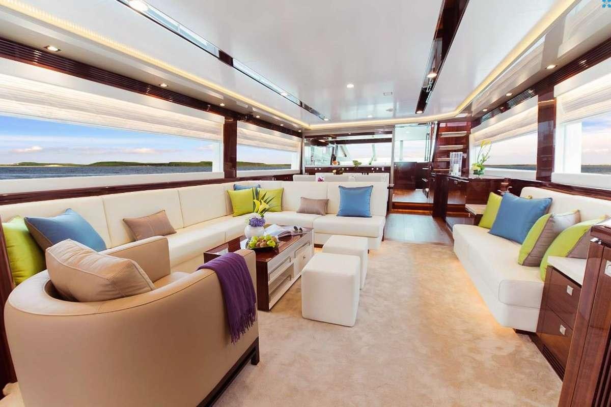 a living room with a couch and a table aboard AQUA LIFE Yacht for Charter